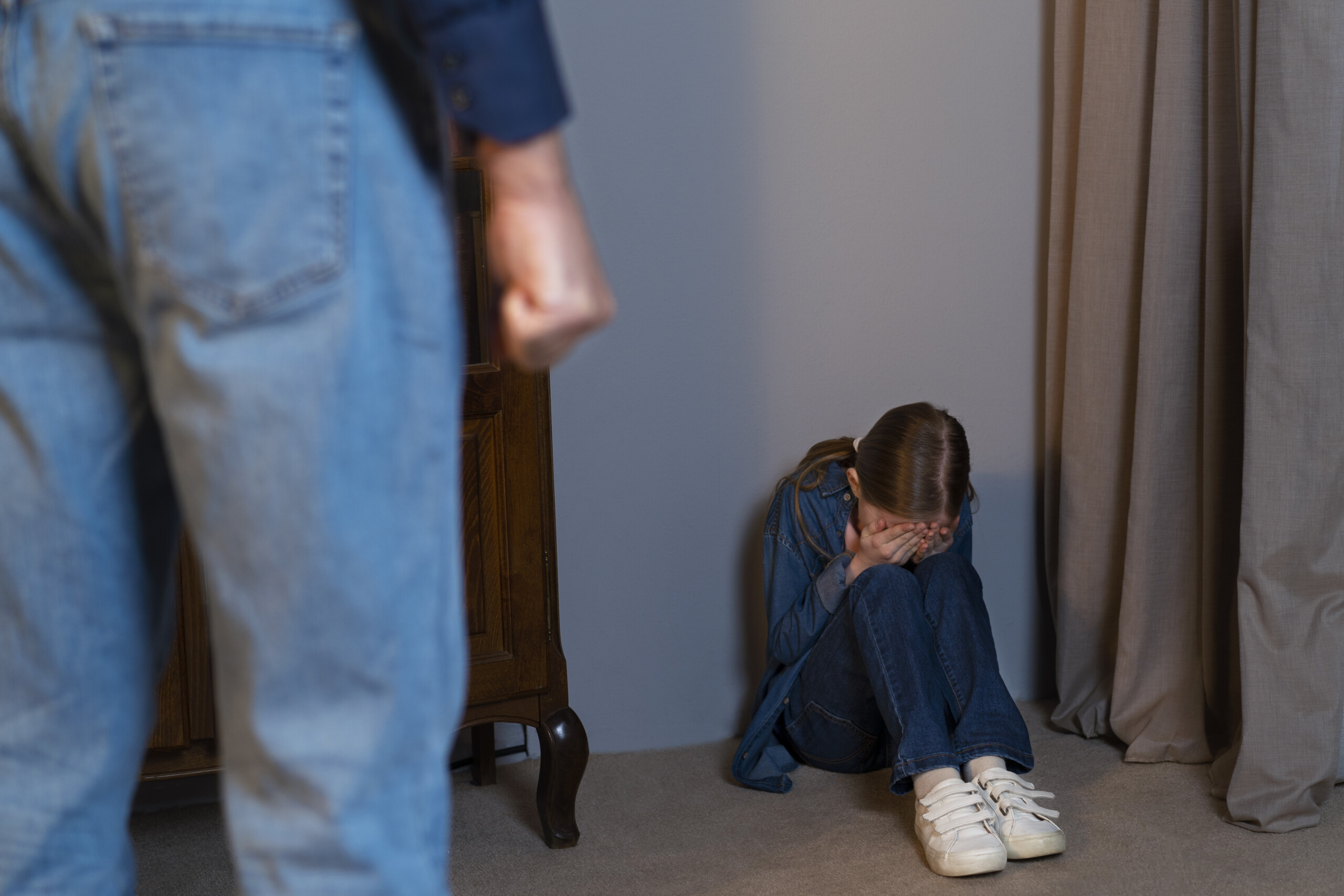 young-child-suffering-abuse-by-parent-with-belt